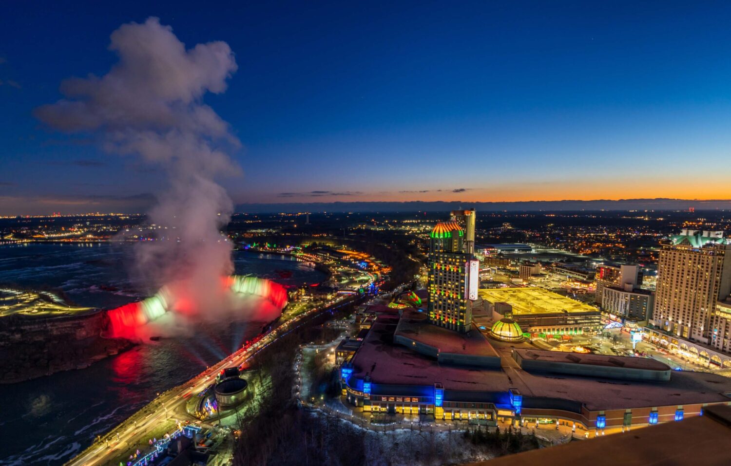 Aerial View Niagara Falls City at night 516399161 scaled e1731703327992